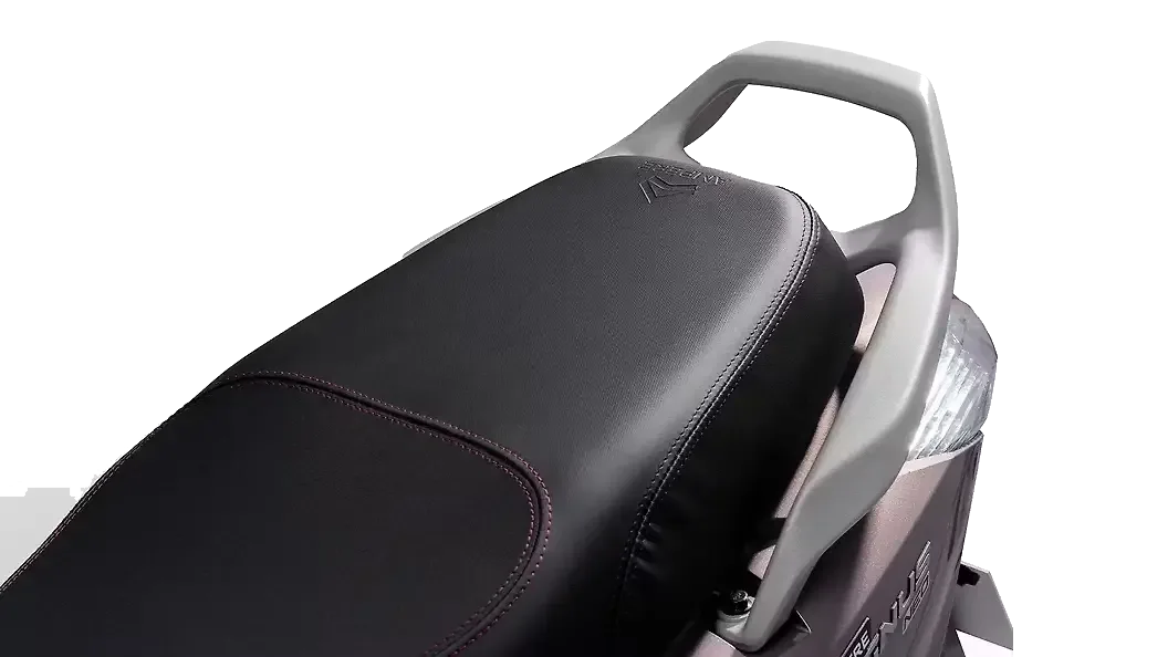 Close-up of the black leatherette seat on an Ampere Magnus Neo with red contrast stitching and embossed logo