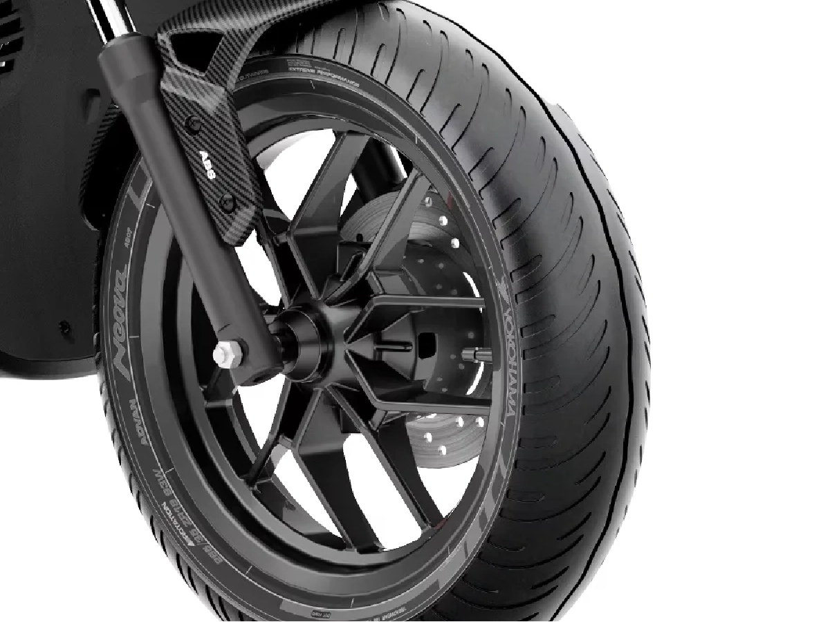Close-up of Aprilia SR 125 front wheel, tyre and disc brake setup