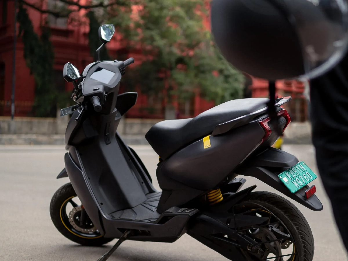 Grey Ather 450 electric scooter parked side profile view