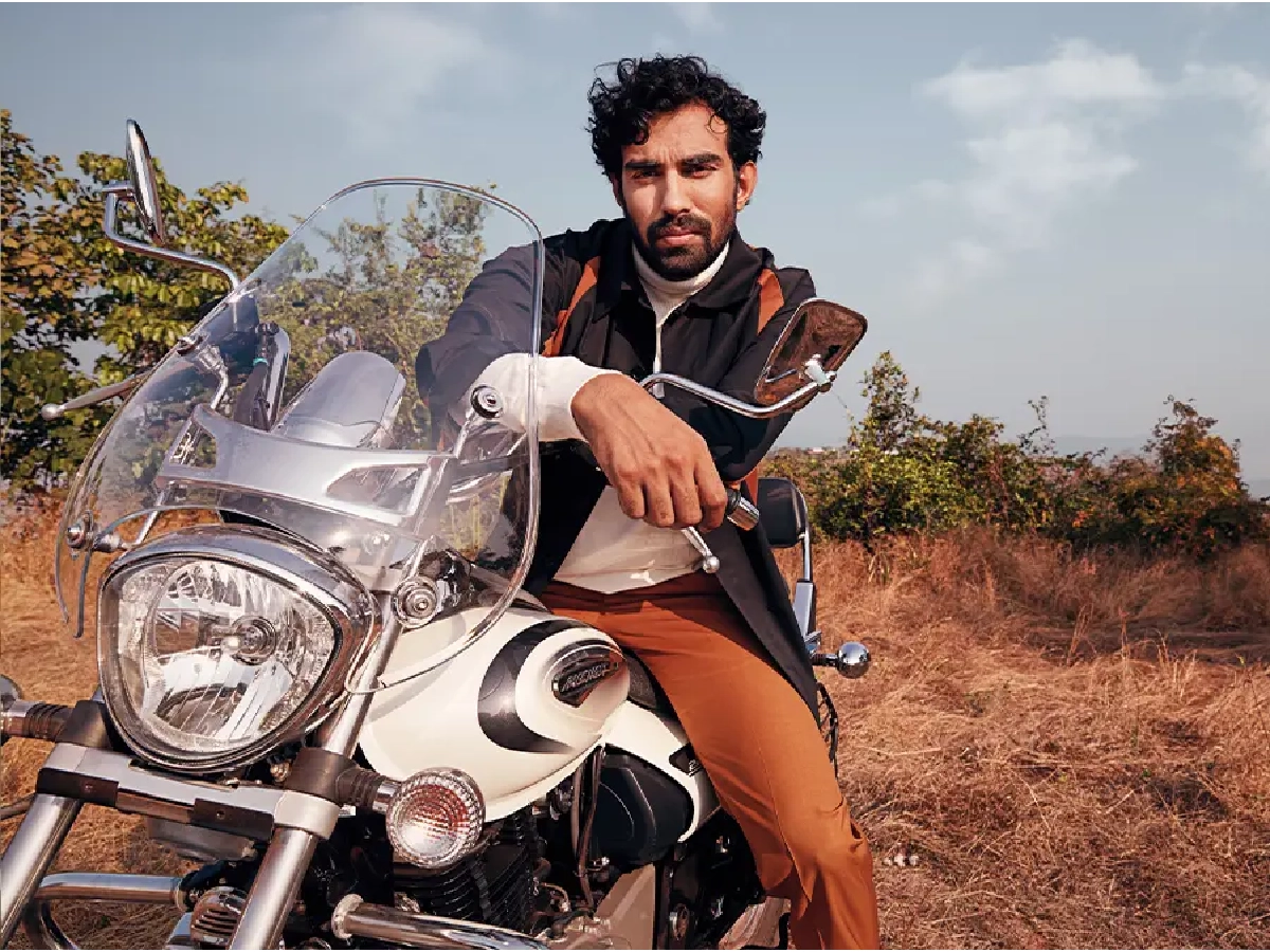 Rider posing with Bajaj Avenger Cruise 220 close-up front view