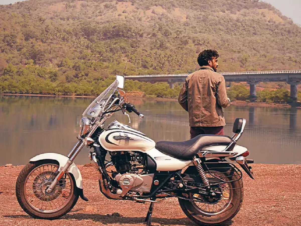 Bajaj Avenger Cruise 220 parked near lakeside with rider