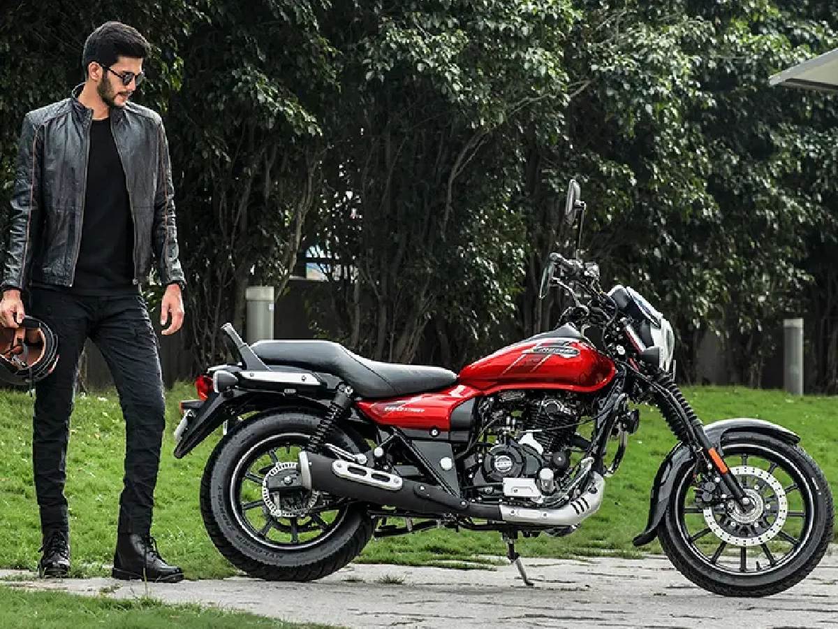Bajaj Avenger Street 160 Spicy Red parked with rider nearby