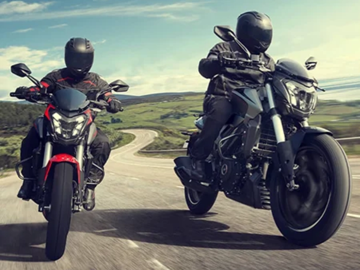 Two Bajaj Dominar 250 motorcycles riding on winding road