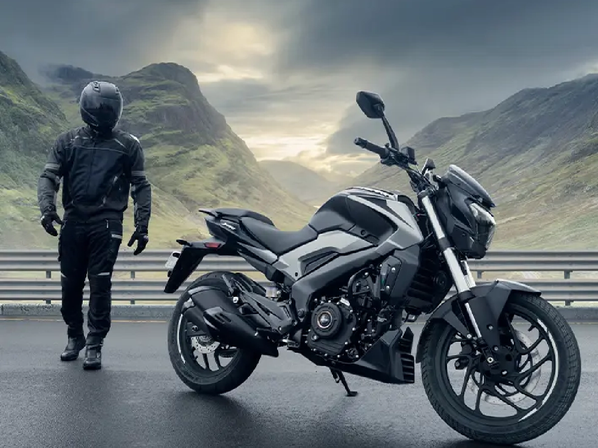Bajaj Dominar 250 Sparkling Black parked beside rider outdoors
