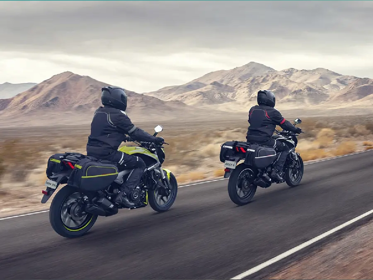 Bajaj Dominar 250 motorcycles equipped with touring luggage on highway