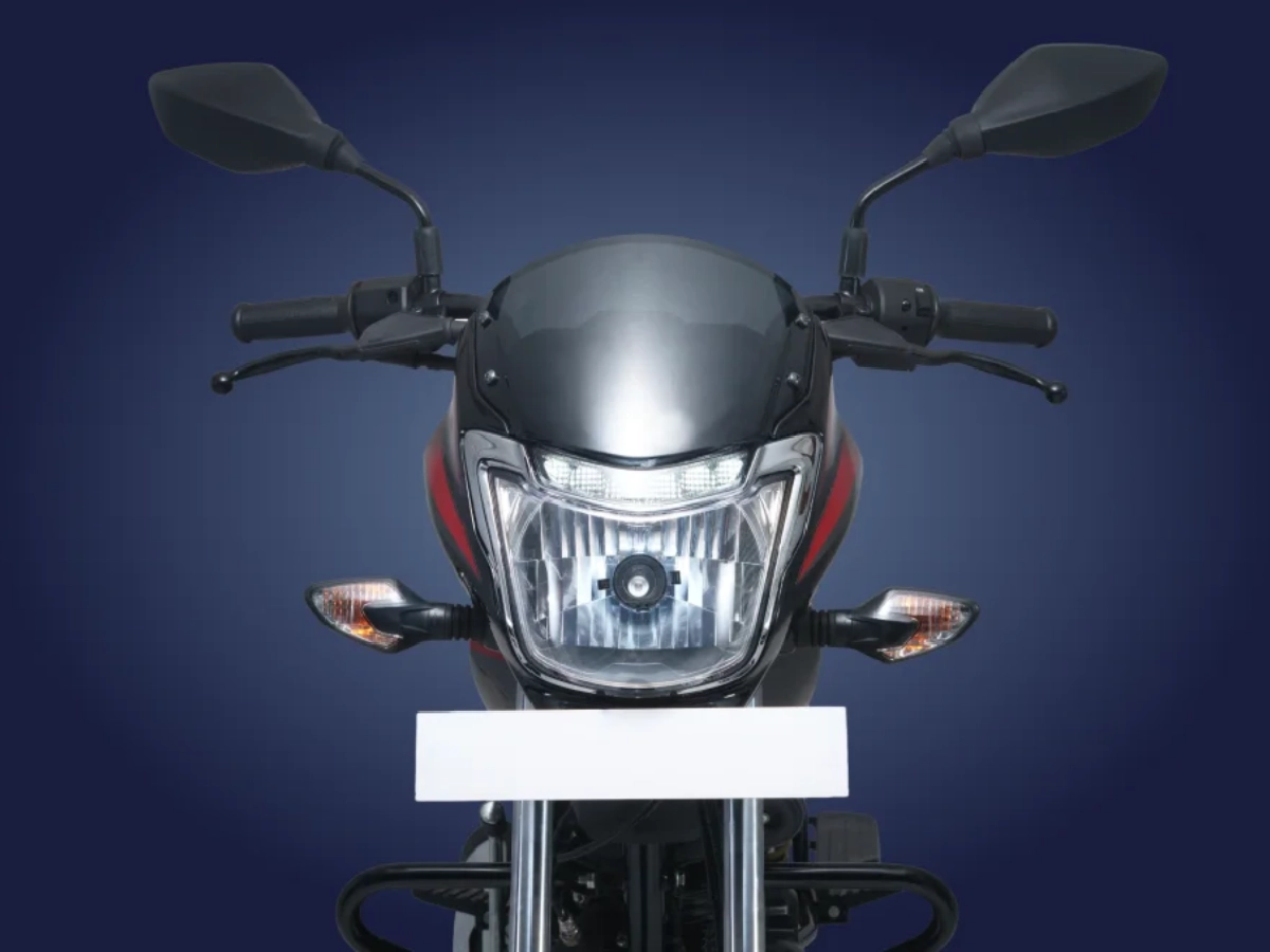 Front headlamp close up of Bajaj Platina 110 Drum motorcycle