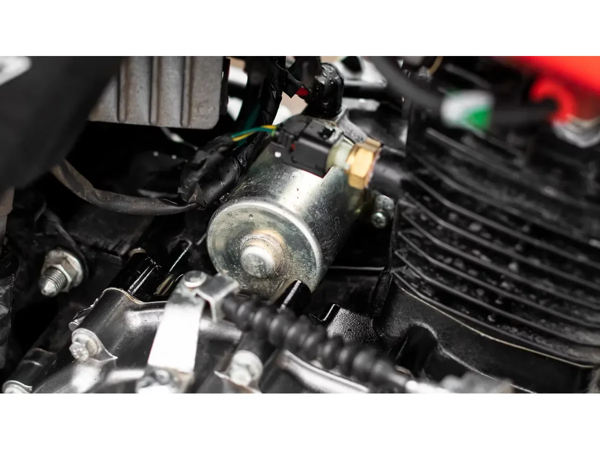 Close-up of Hero Glamour electric starter motor assembly