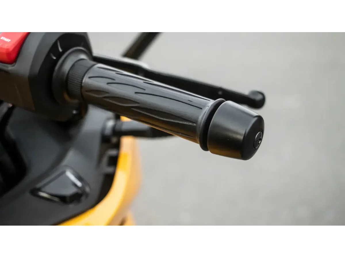 Close-up of Hero Karizma XMR handlebar grip and bar end weight