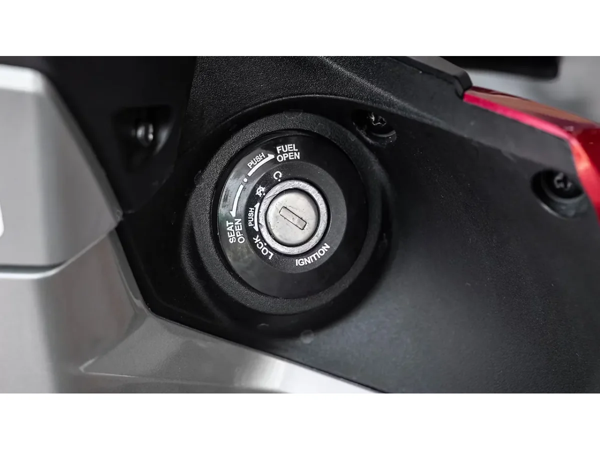 Hero Xoom 125 fuel lid release switch detail