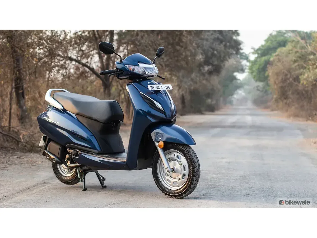 Honda Activa 6G Pearl Siren Blue front right lifestyle image