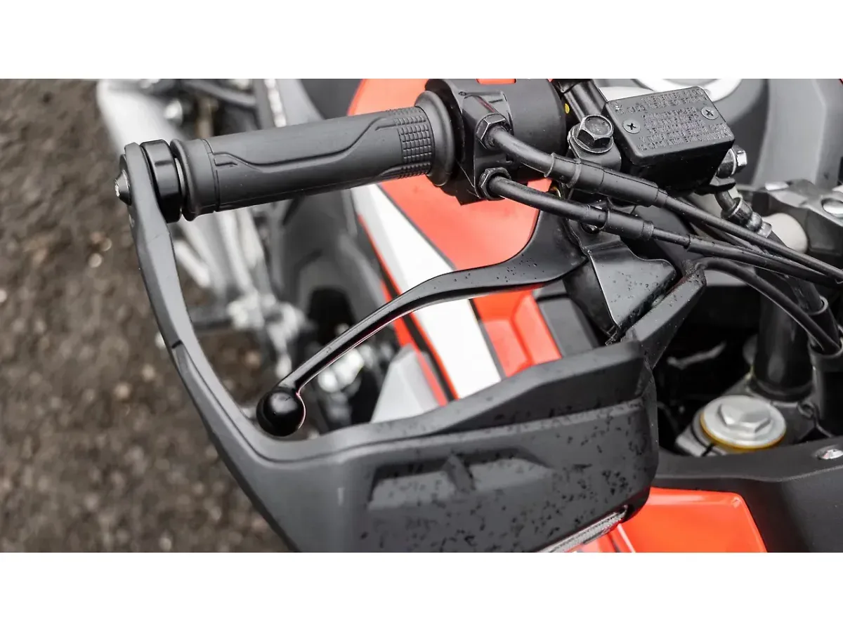Honda CB200X left handlebar and handguard close-up