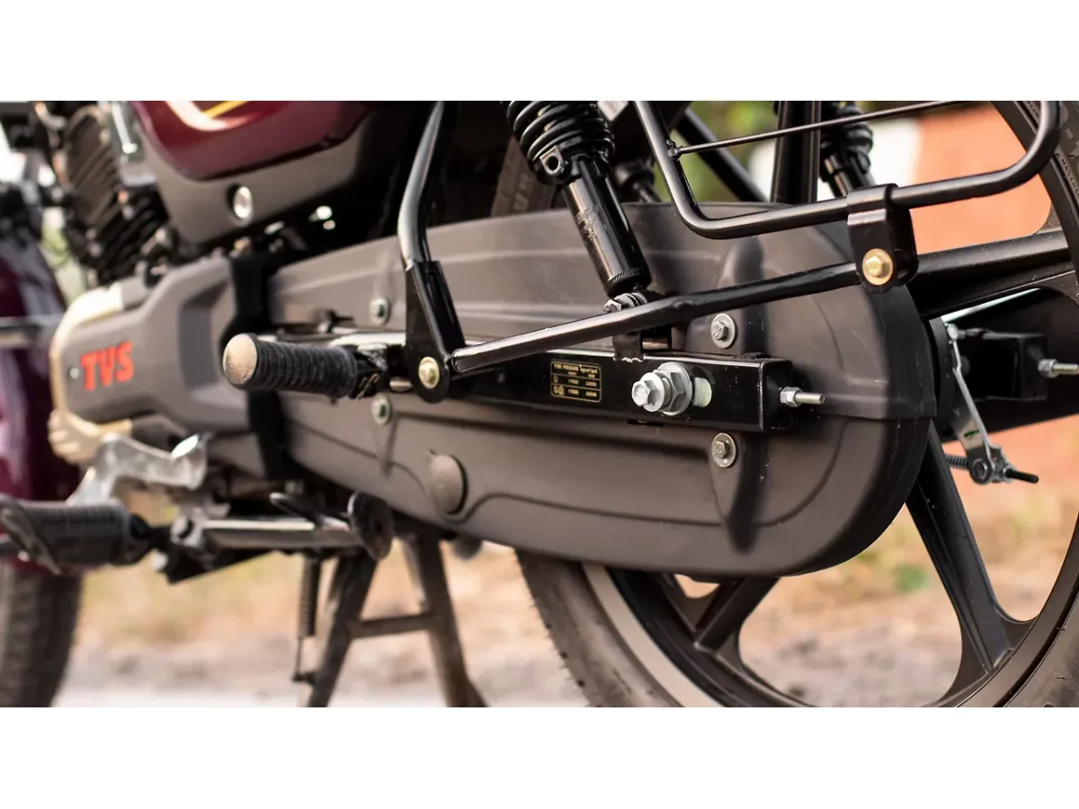 Close-up of the TVS Radeon chain cover and rear footrest