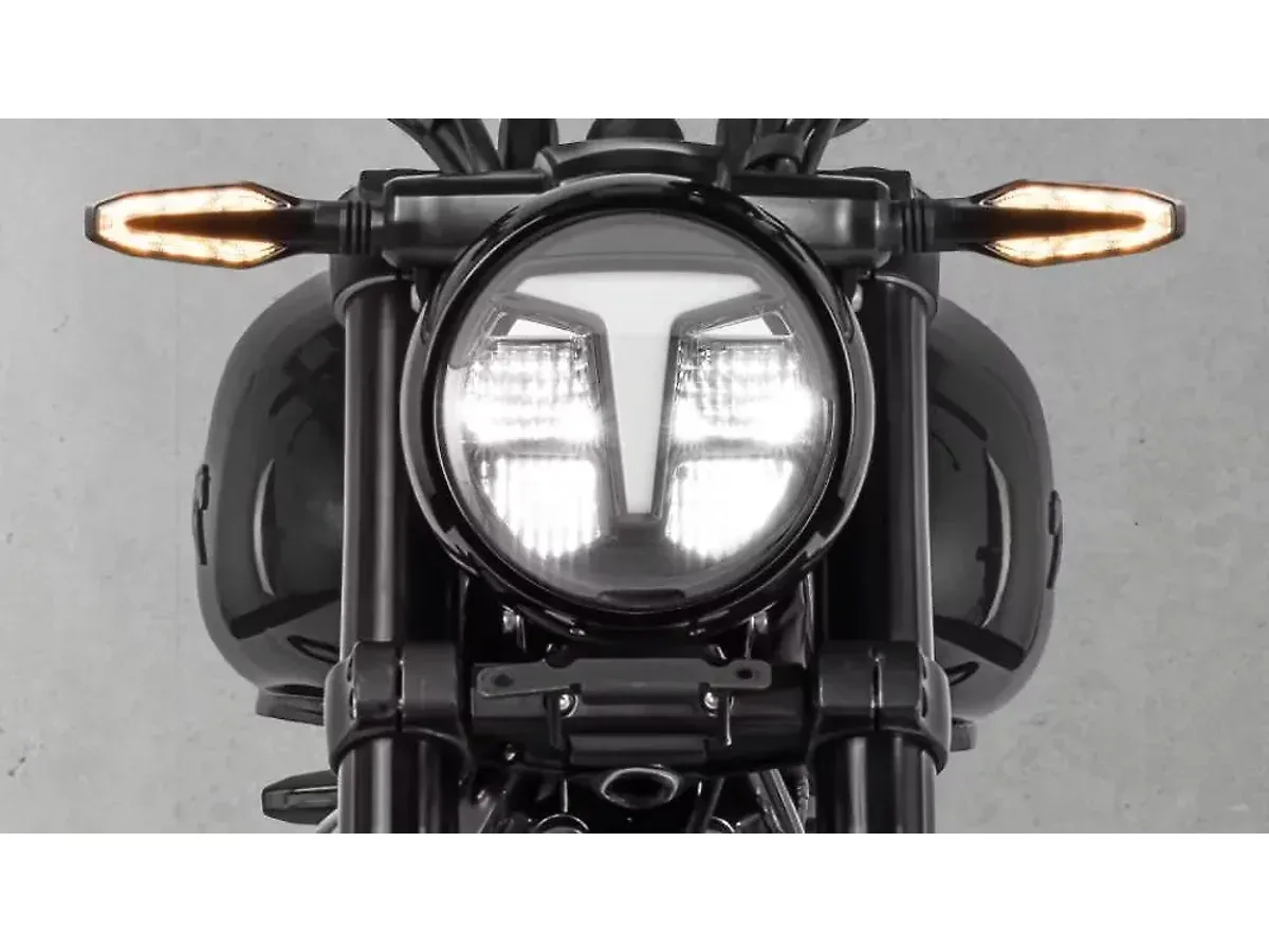 Close-up of the TVS Ronin round LED headlight