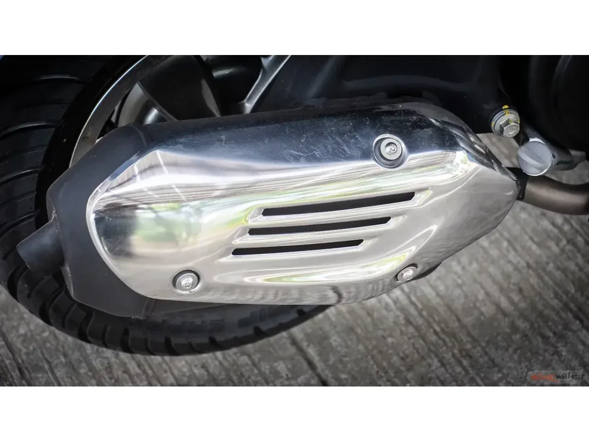Close-up of the Vespa SXL 150 exhaust and heat shield