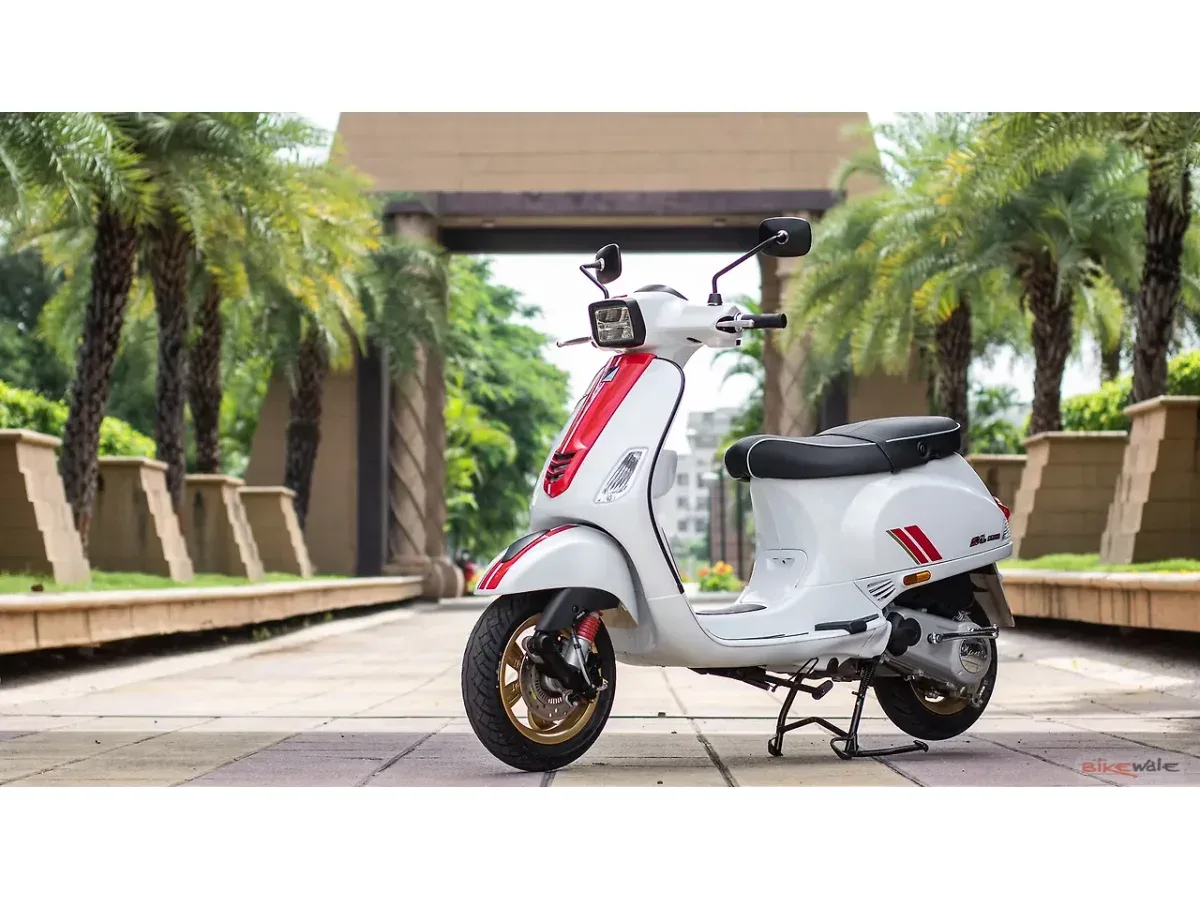 White Vespa SXL 150 shown from the front-left angle outdoors