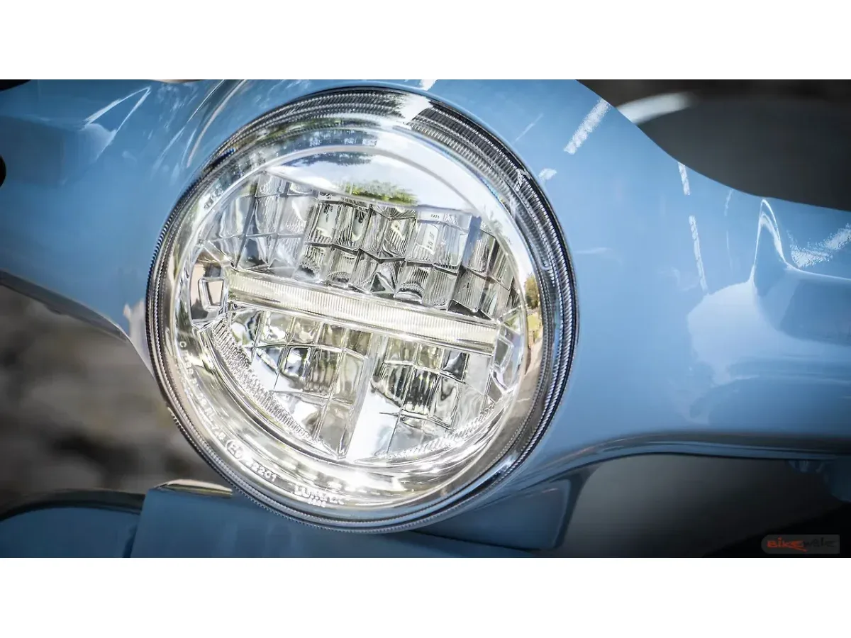 Close-up of the Vespa SXL 150 round headlamp