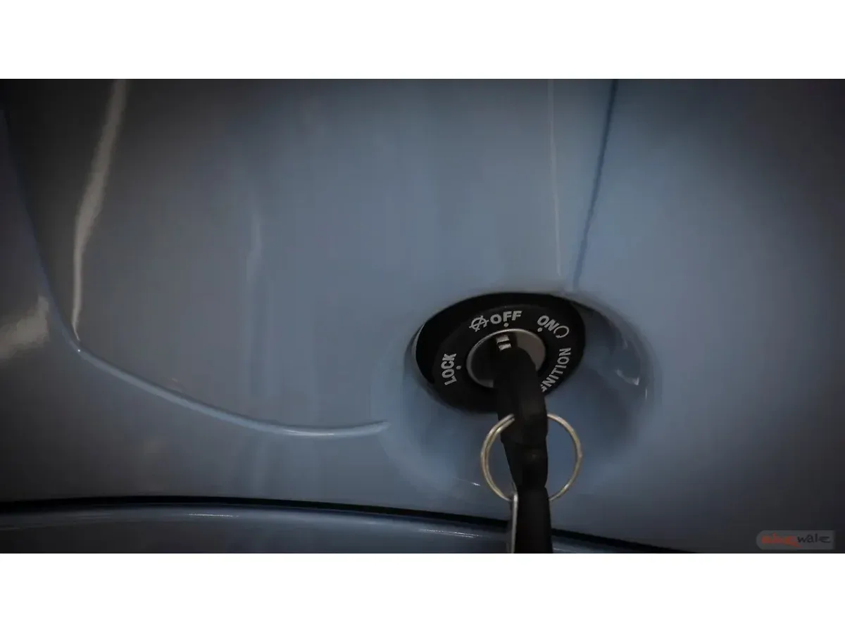 Close-up of the Vespa SXL 150 ignition switch and key