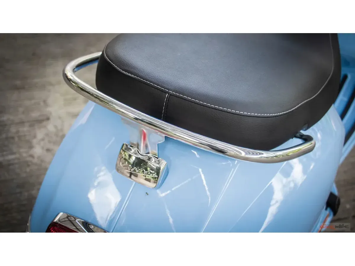 Close-up of the Vespa SXL 150 rear grab rail and seat