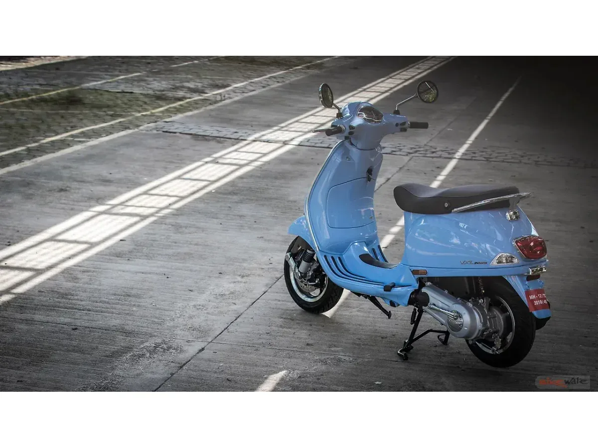White Vespa SXL 150 shown from the rear-left angle