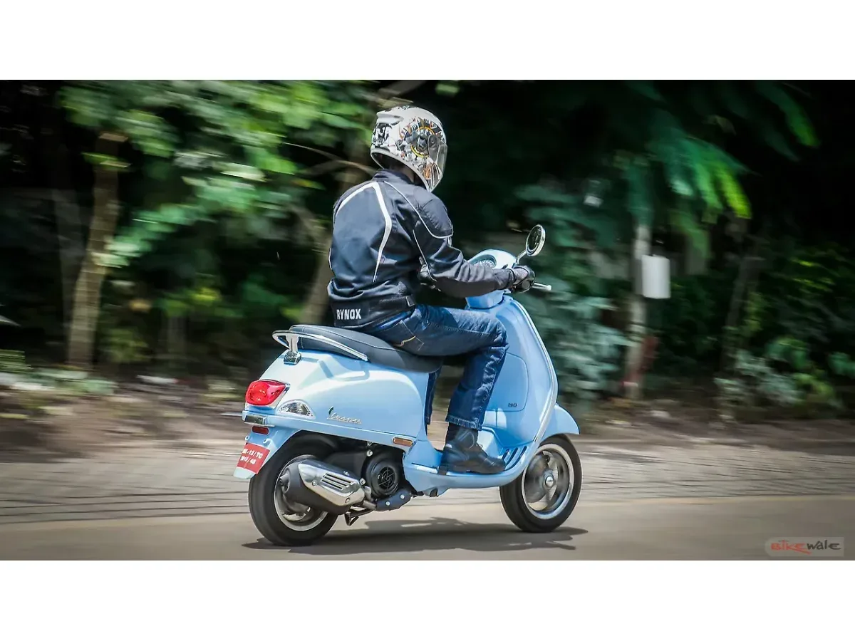 Vespa SXL 150 being ridden on a road