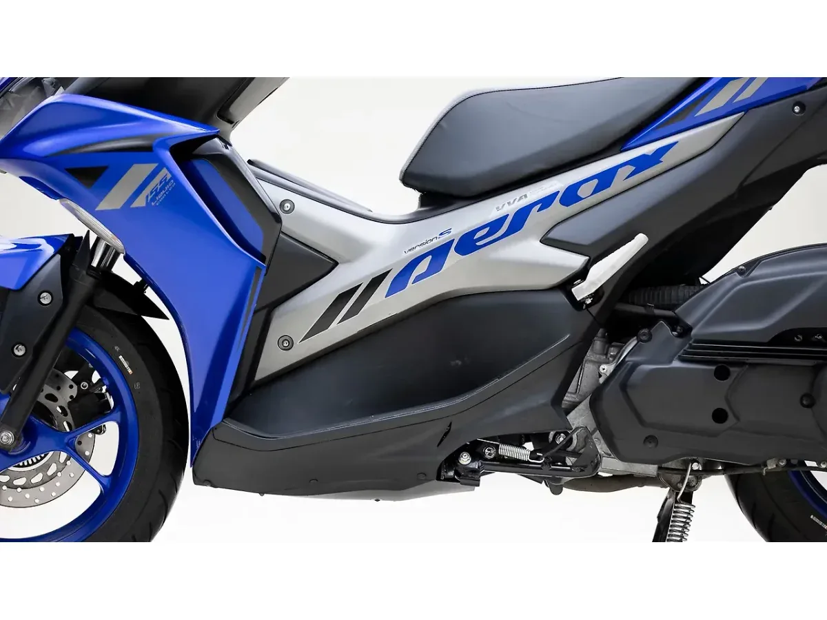 Close-up of the Yamaha Aerox 155 left-side body panel and graphics
