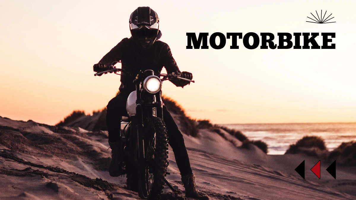 Motorbike rider riding through sand dunes at sunset near the beach